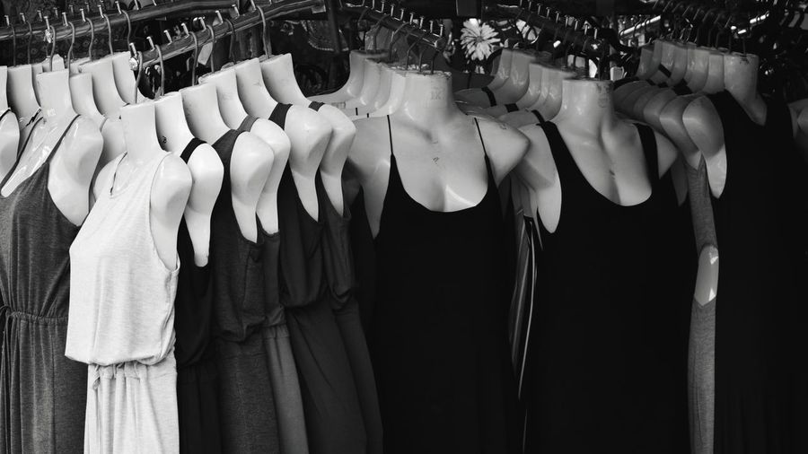 Clothes hanging on rack in store ,industry stucked in 90s