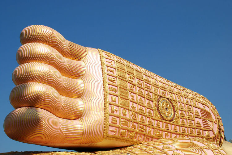 The footprint of golden buddha at phrae thailand