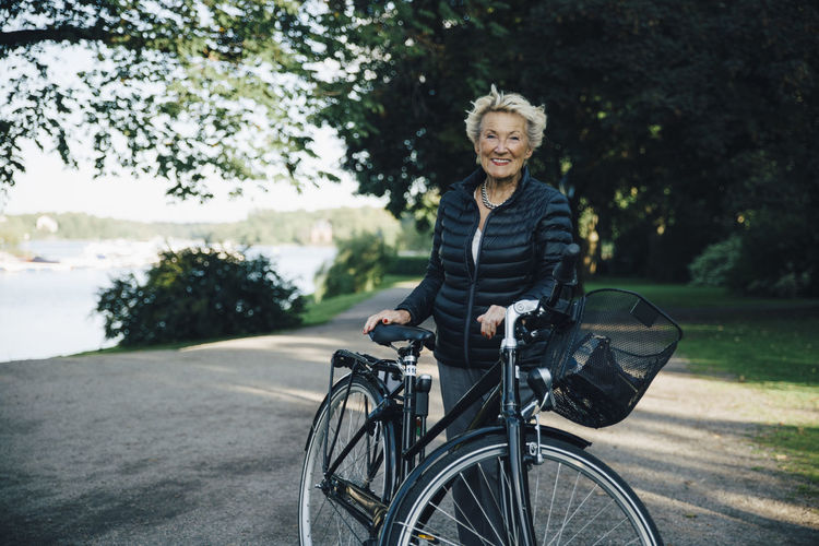 Portrait of smiling woman riding bicycle