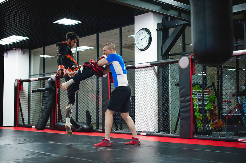 People practicing boxing in ring