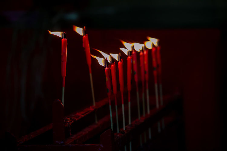 Close-up of candles in row