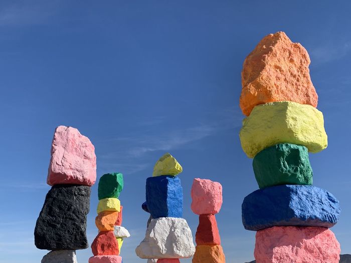 Stack of rocks against blue sky