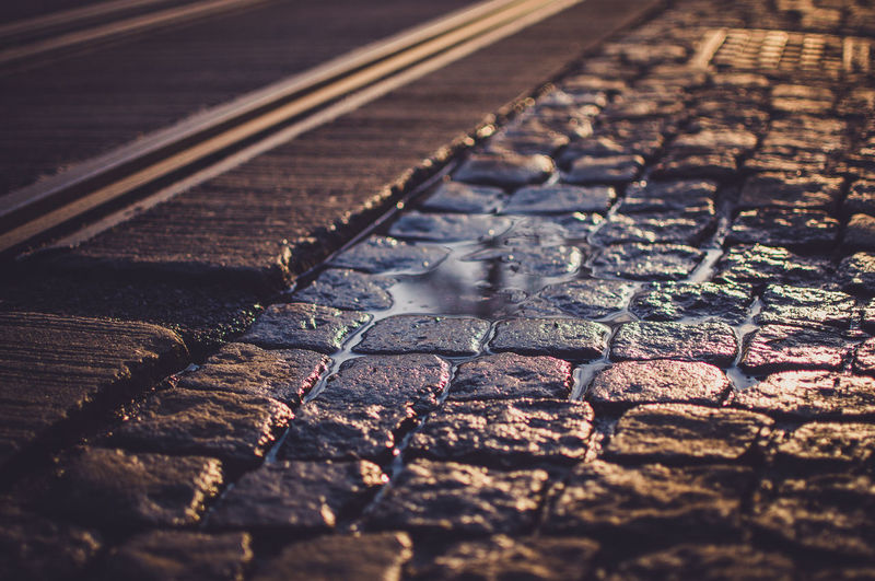 High angle view of wet street during sunset