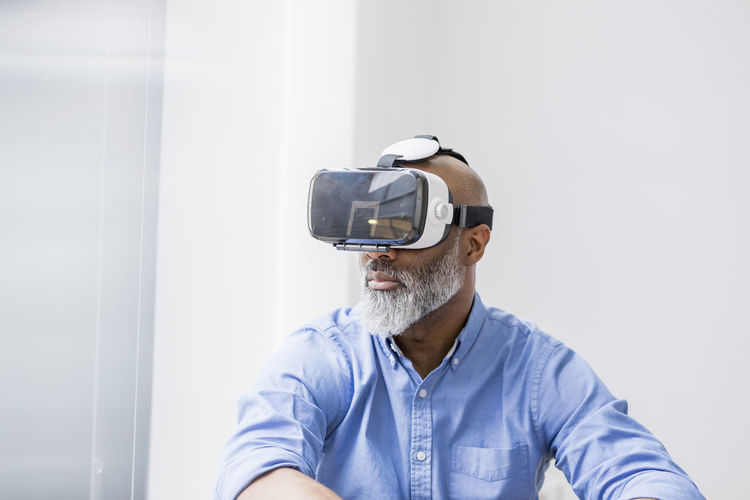 Businessman using virtual reality glasses