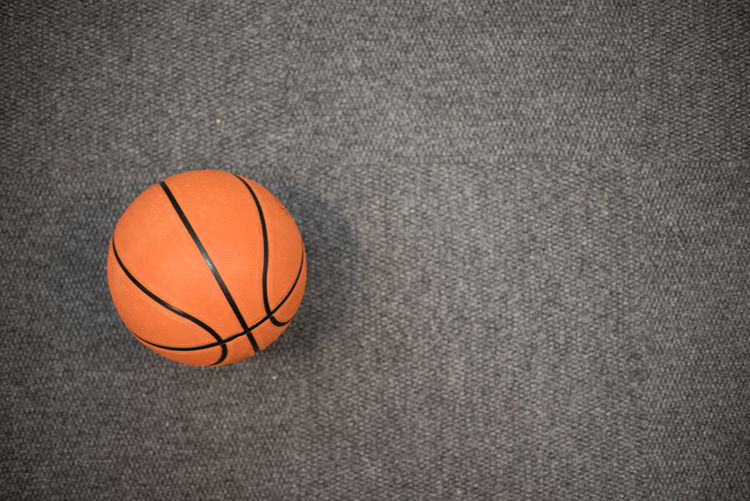 Directly above shot of basketball over gray background