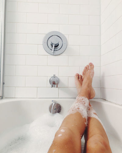 Woman relaxing in the bubble bath at home