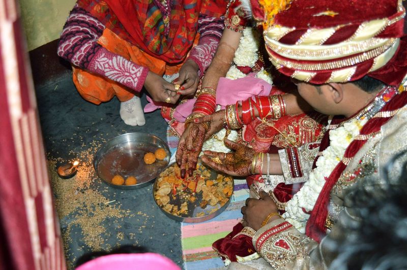 Midsection of couple in wedding ceremony