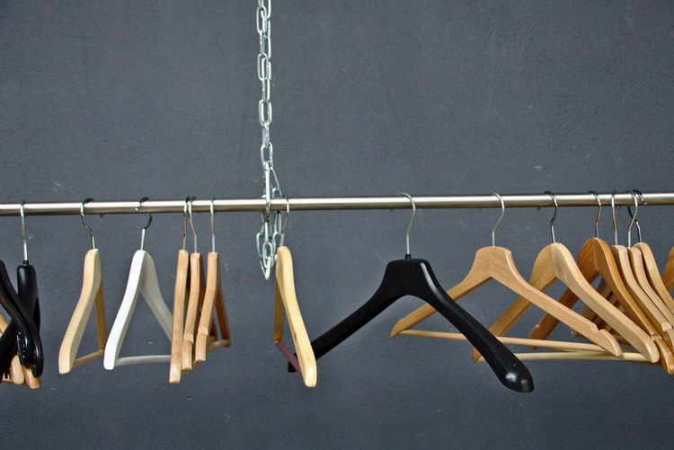 Clothes hanging on rope against wall