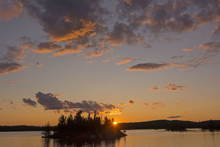 Dramatic sunset on saganagons lake in quetico provincial park