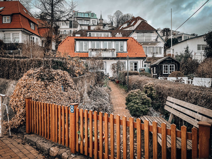 Houses against buildings in city