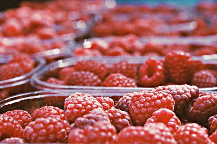 Close-up of raspberries in containers