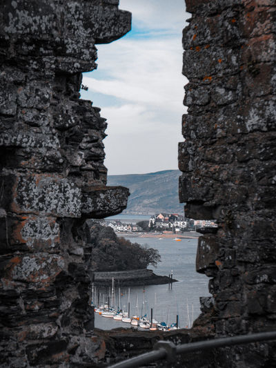 Boats through the hole in a castle wall
