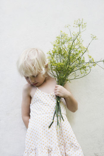 Girl holding plant