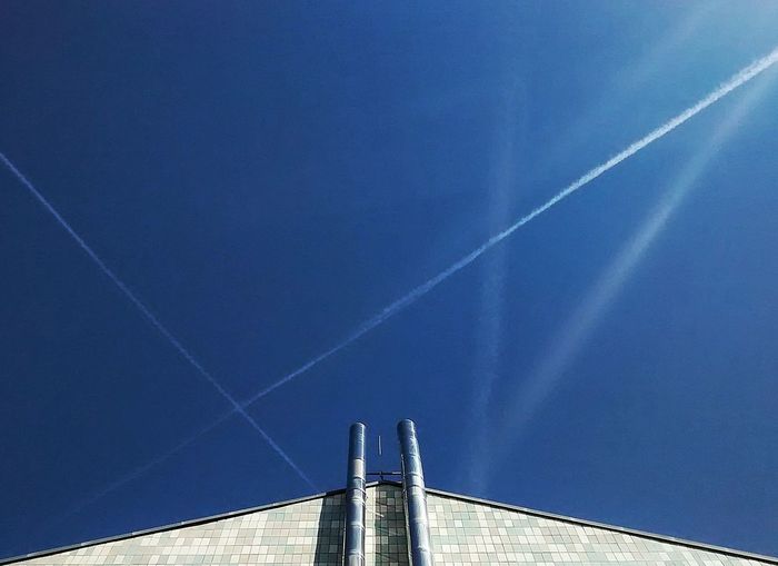Low angle view of built structure against blue sky