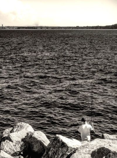 Man fishing in sea