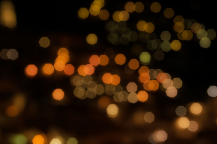 Defocused image of illuminated lights at night