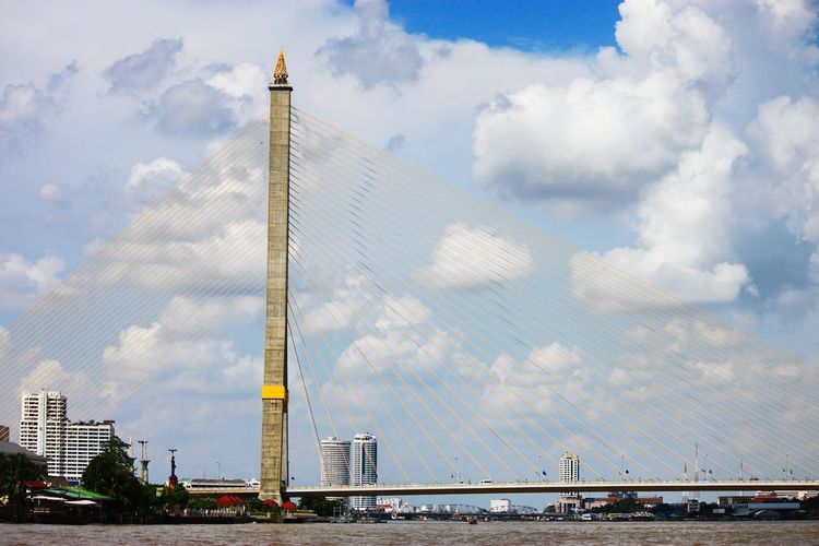 Rama viii bridge over chao phraya river against sky