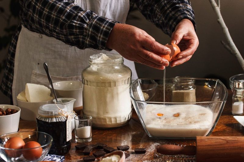 Midsection of man preparing food in kitchen