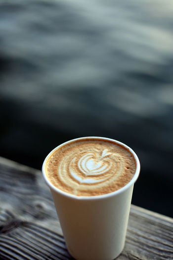 Close-up of cappuccino on table