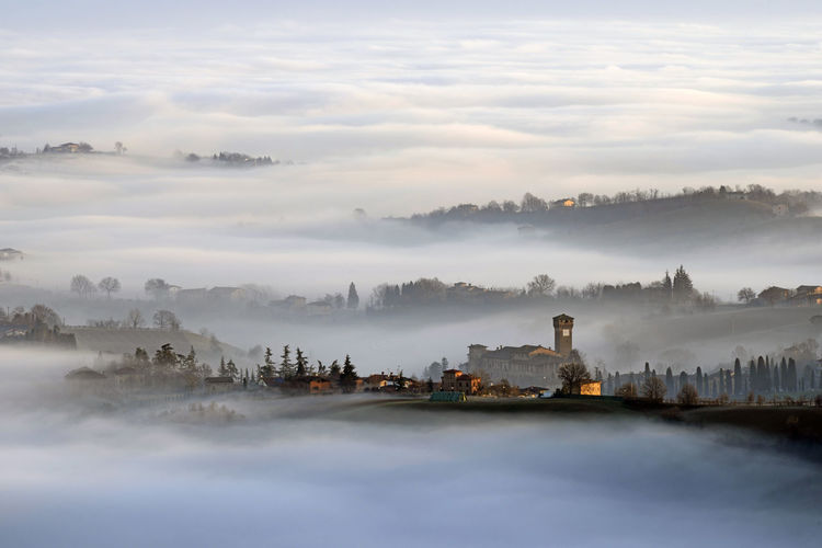 Scenic view of sea against sky during foggy weather