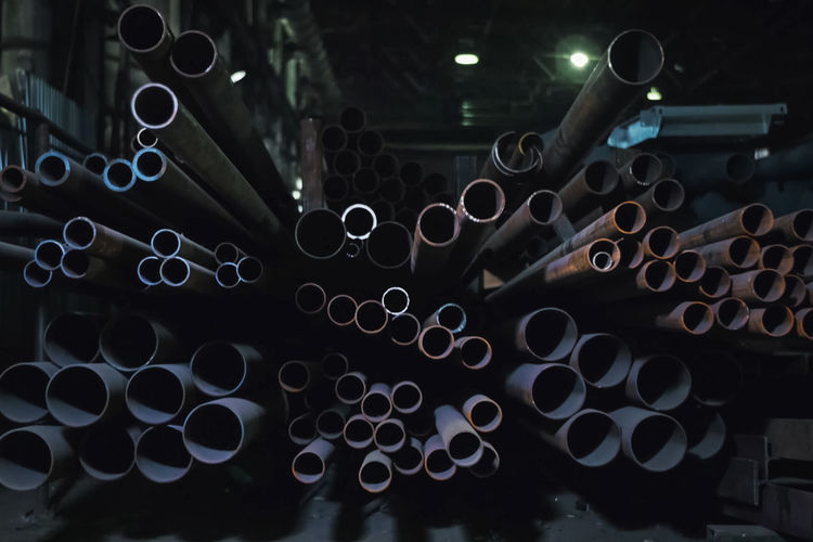 Close-up of metallic pipes in factory