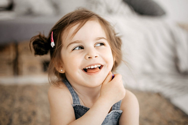 Portrait of a funny little girl with beautiful eyes and a smile.
