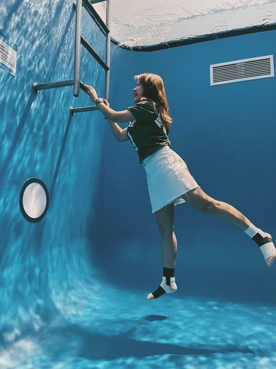 Woman exercising in swimming pool