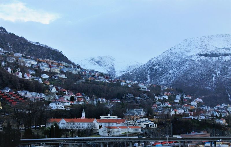 View of mountain village against sky during winter