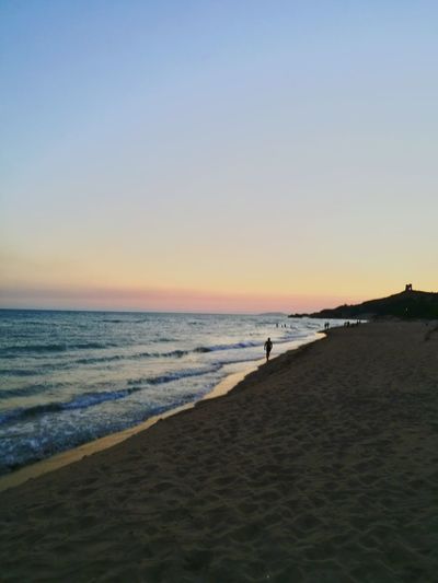 Scenic view of beach during sunset