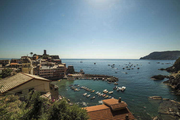 Buildings by sea against sky at cinque terre