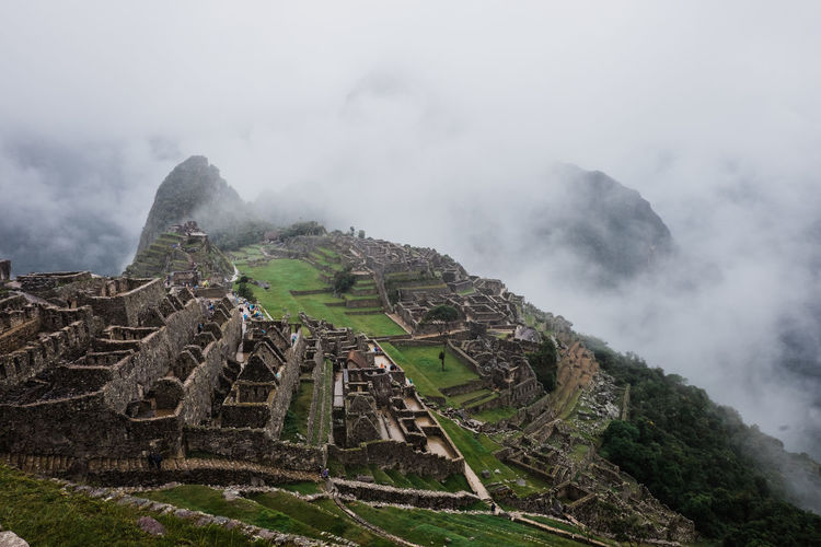 View towards machu picchu on a cloudy and rainy day.