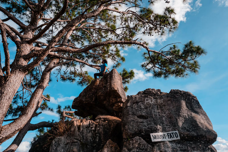 Low angle view of rock formation against sky