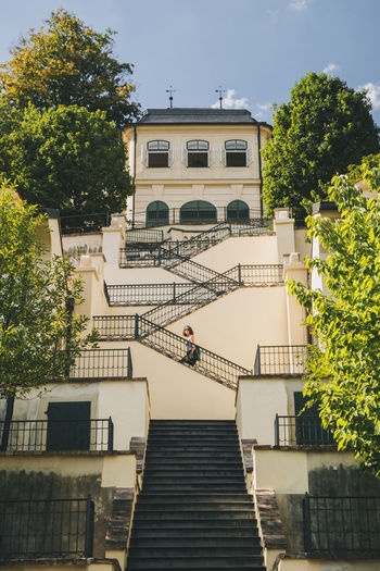 Woman going up the stairs at fürstenberg garden, prague, czech