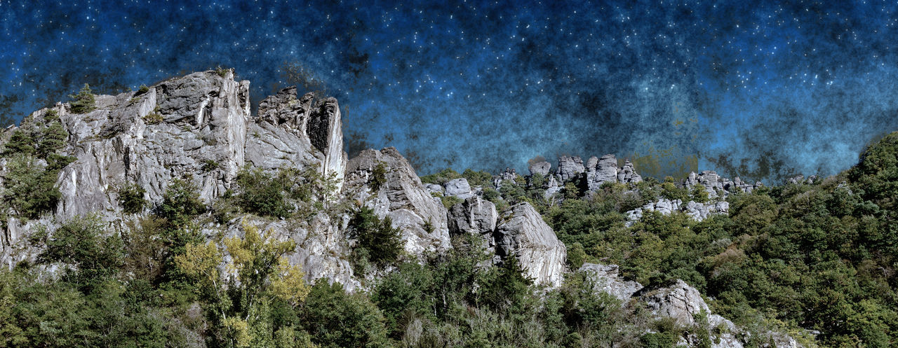 Panoramic view of rock formations against sky