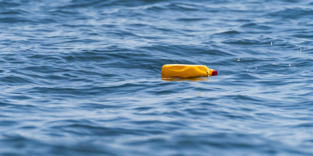 Yellow toy floating on sea