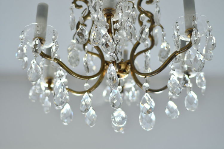 Low angle view of chandelier hanging at ceiling