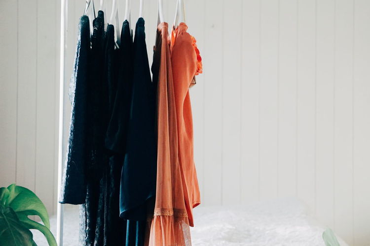 Clothes hanging against wall at home