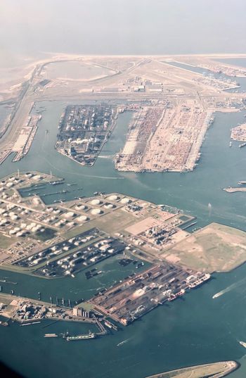 High angle view of sea and buildings in city