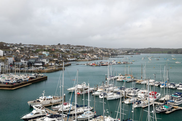 Landscape photo of boats floating in the harbor in falmouth