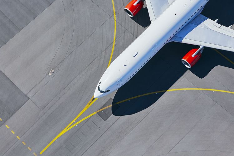 High angle view of airplane at airport runway