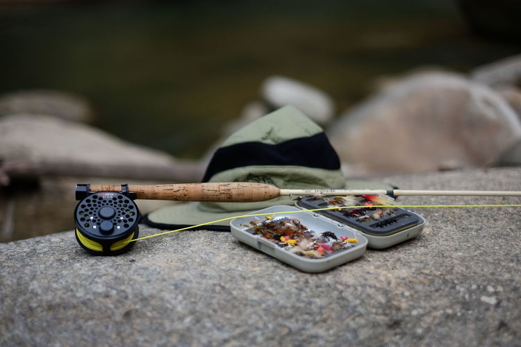 Close-up of fishing equipment on rock