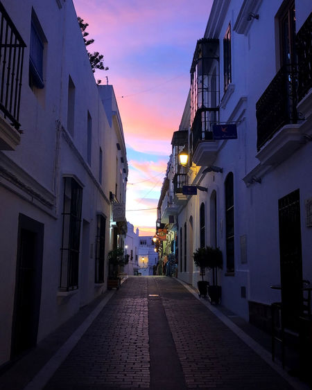 Narrow alley amidst buildings in city