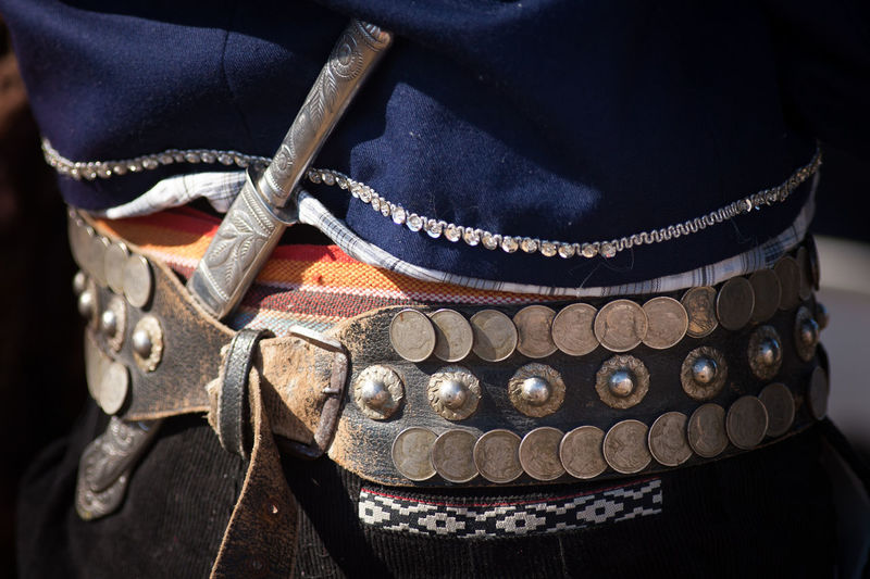 Midsection of gaucho with knife