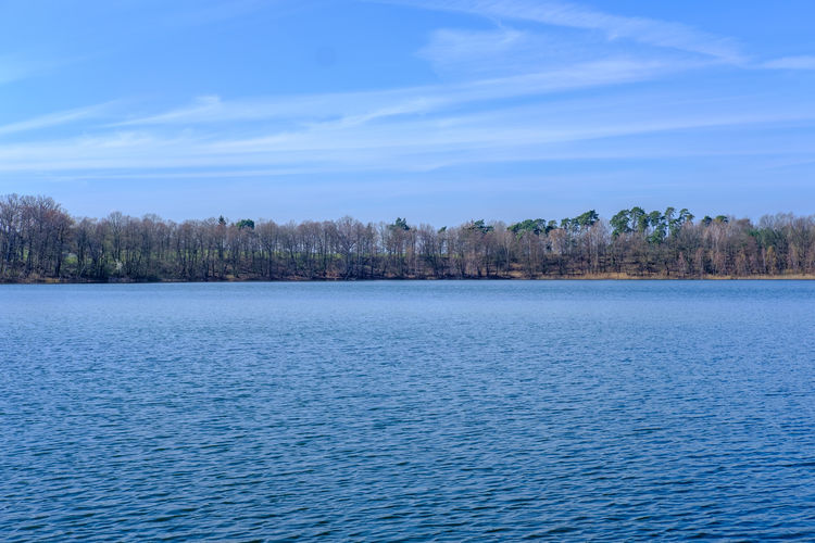 Scenic view of sea against blue sky