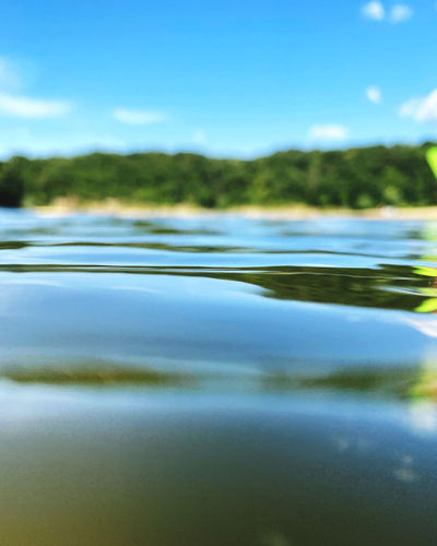 Surface level of lake against sky