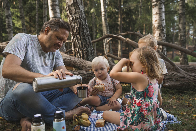 Father with children having picnic