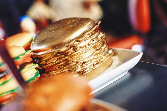 Tilt shot of golden burger on table