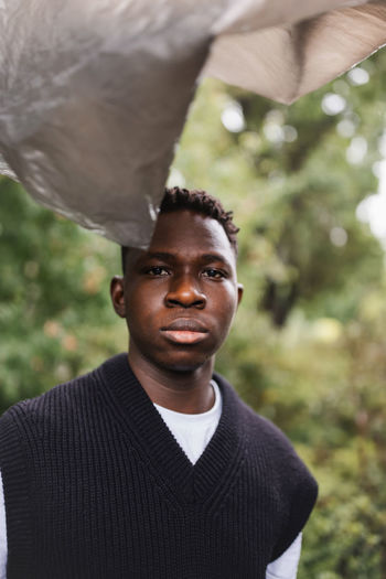 Young african man portrait. plastic pollution, ecology concept