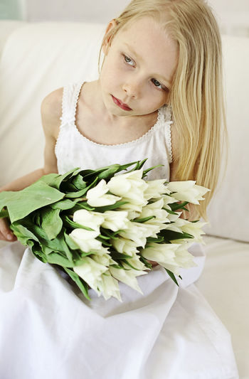 High angle view of pretty girl holding bouquet