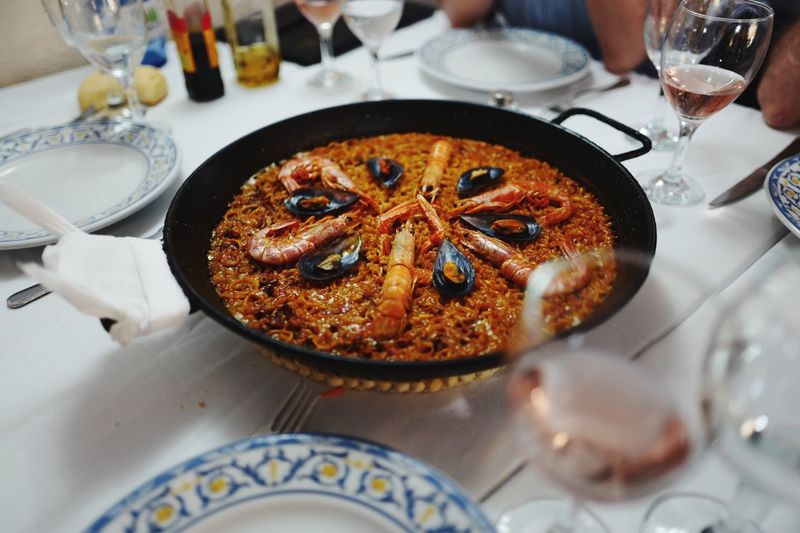 High angle view of paella in plate on table